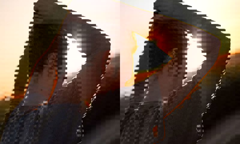 Man with head above his head