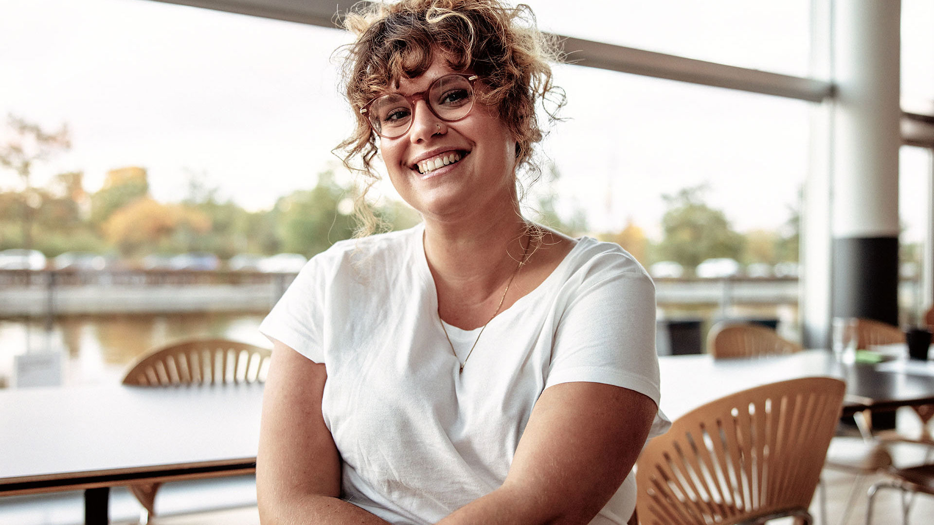 Female wearing glasses in a cafe