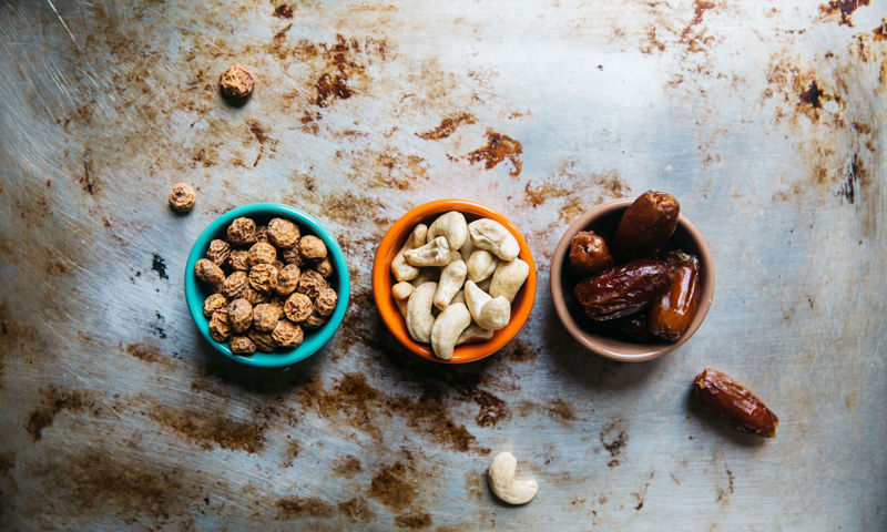 Three foods lined on a bench
