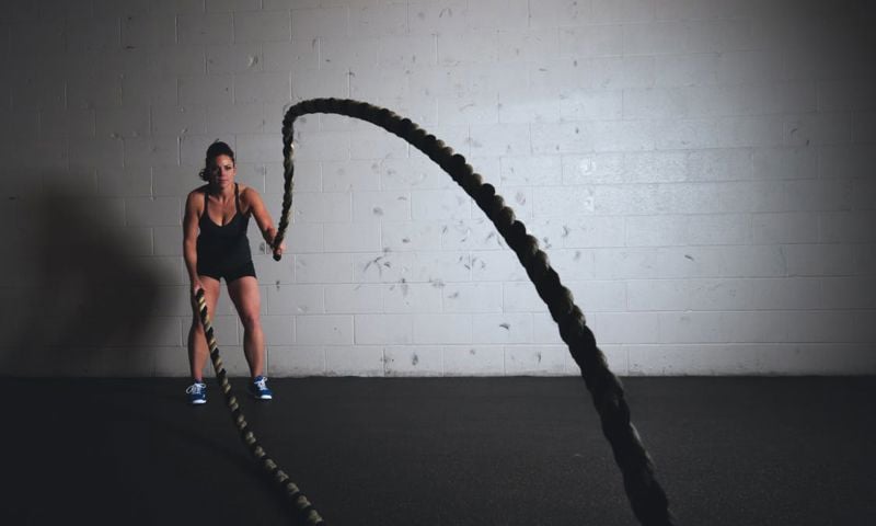 Woman doing ropes at the gym