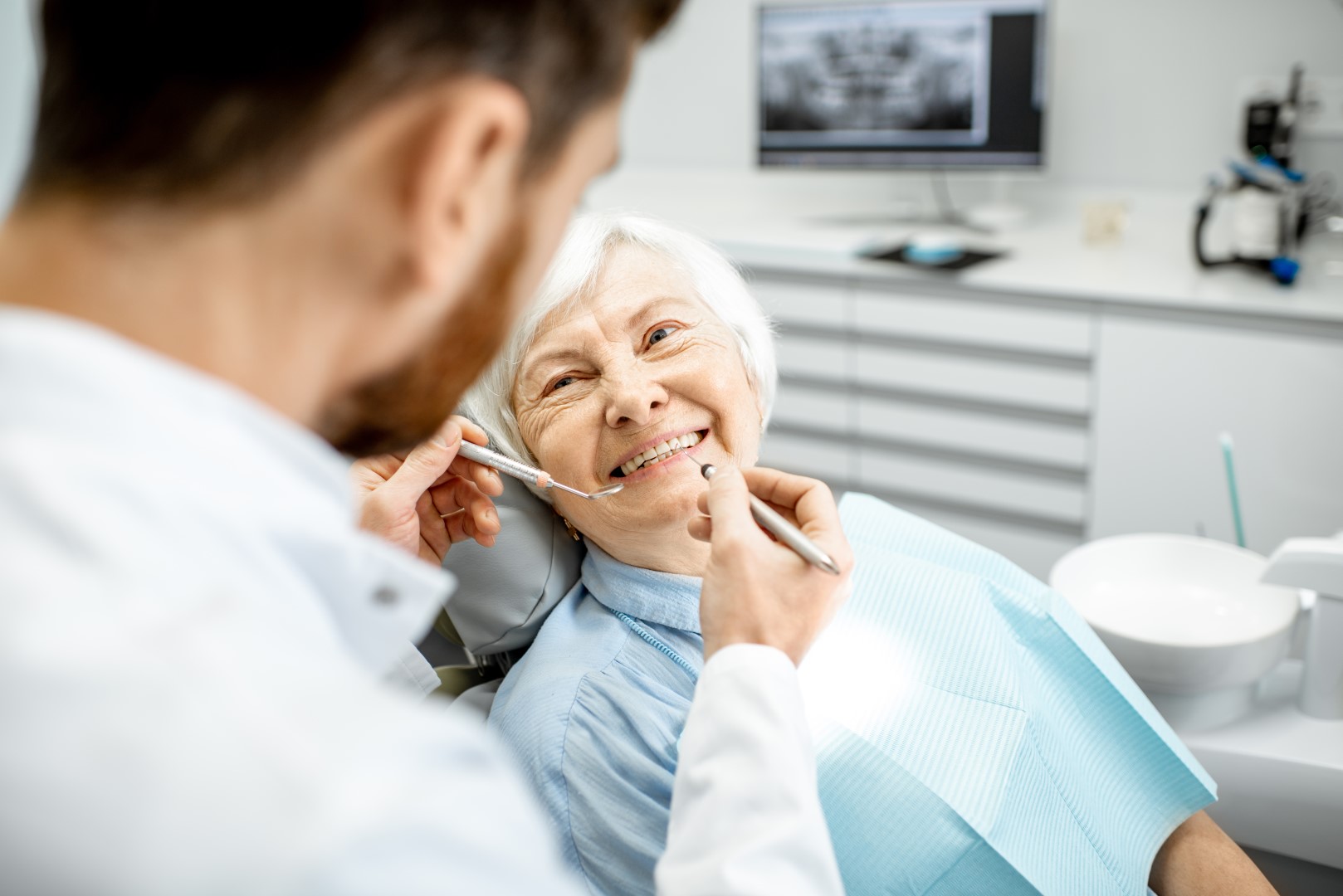 Mature lady getting a dental check-up at GMHBA Dental care