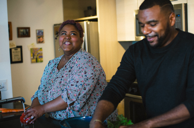 Couple preparing dinner together and talking