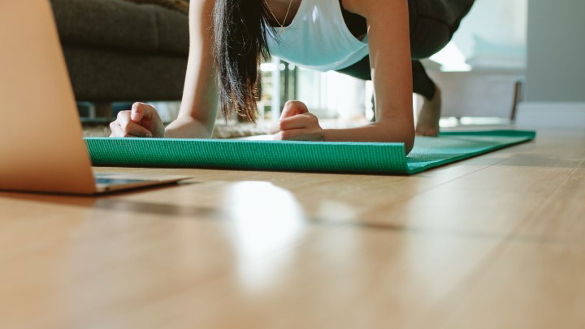 Woman doing Kieser App exercises that she was eligible for through her GMHBA cover