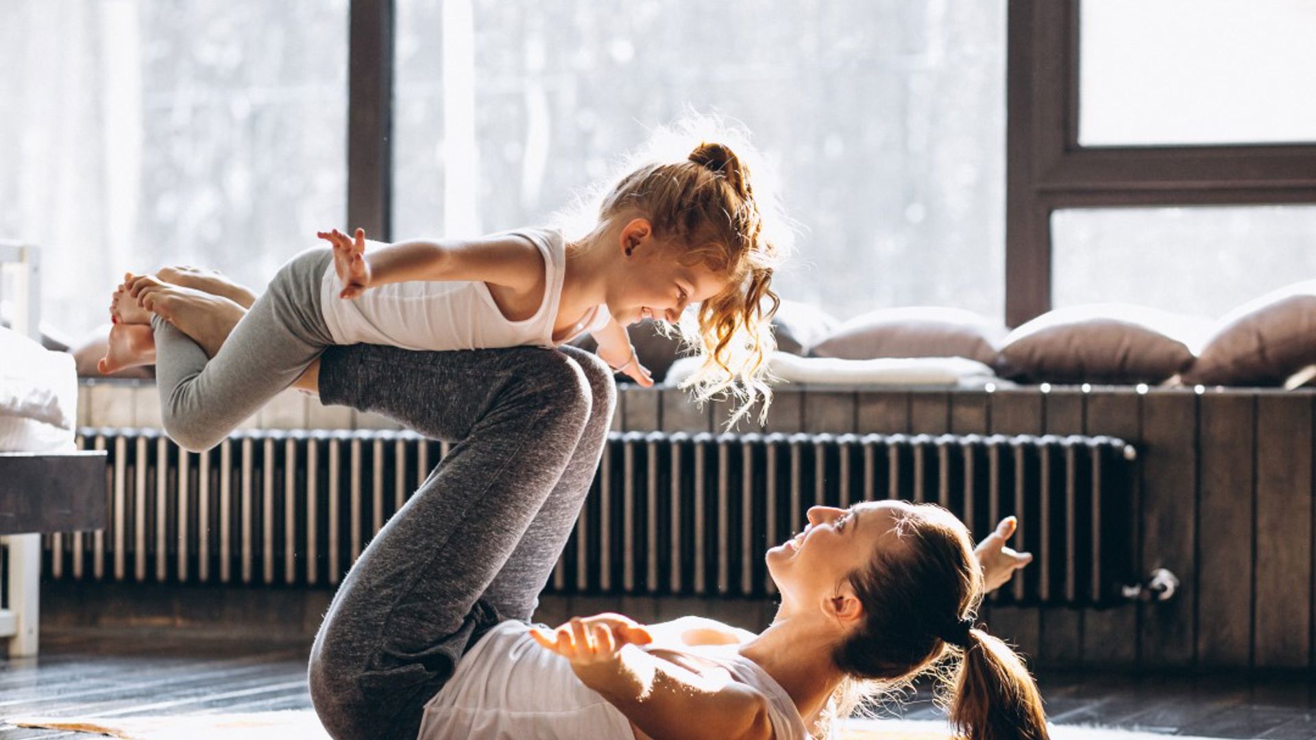 Mother and daughter yoga at home after learning skill at GMHBA seminar