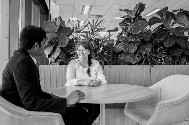 Male and female sitting at lunch table chatting
