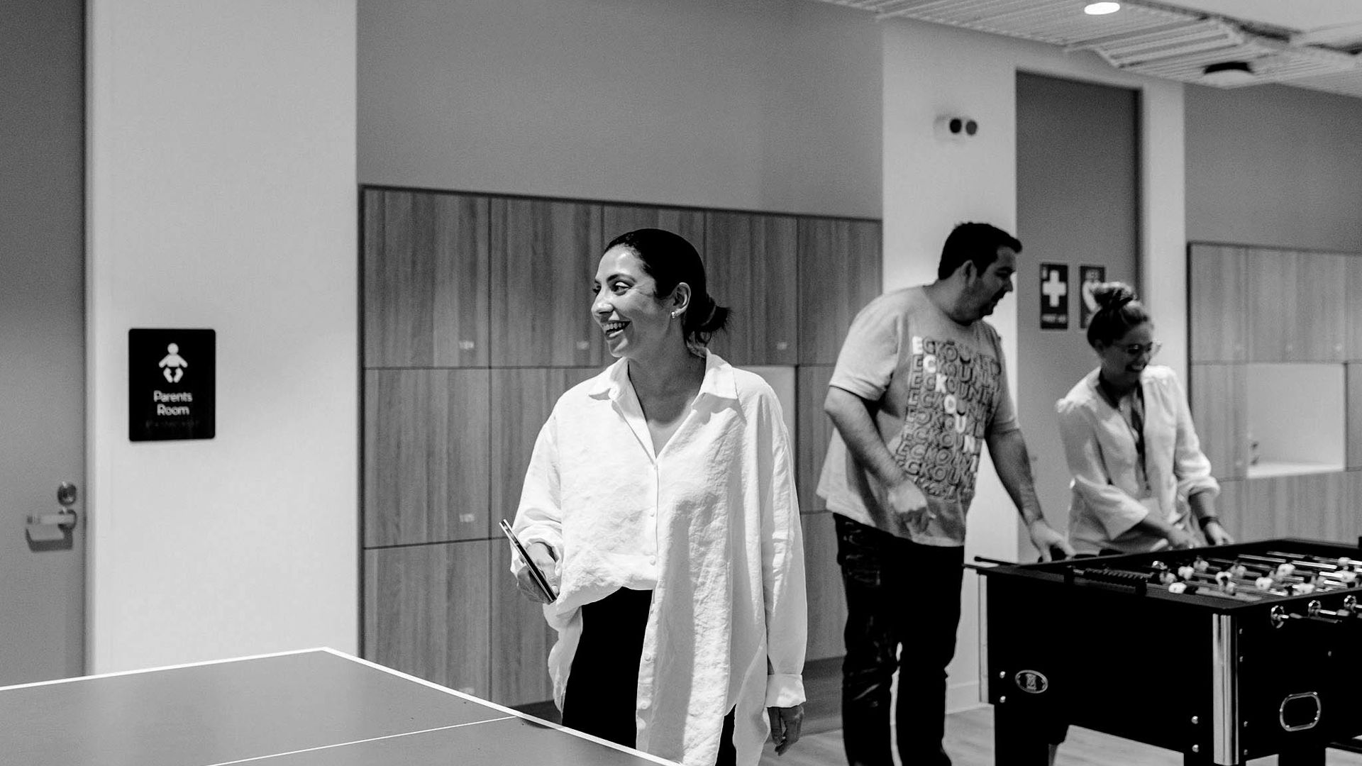 Female health insurance worker playing table tennis