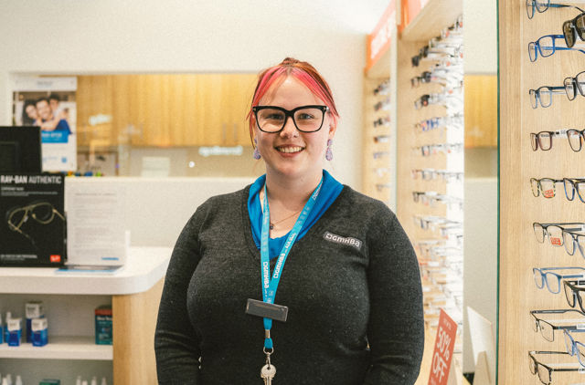 GMHBA Eye Care Geelong retailer worker standing in front of store
