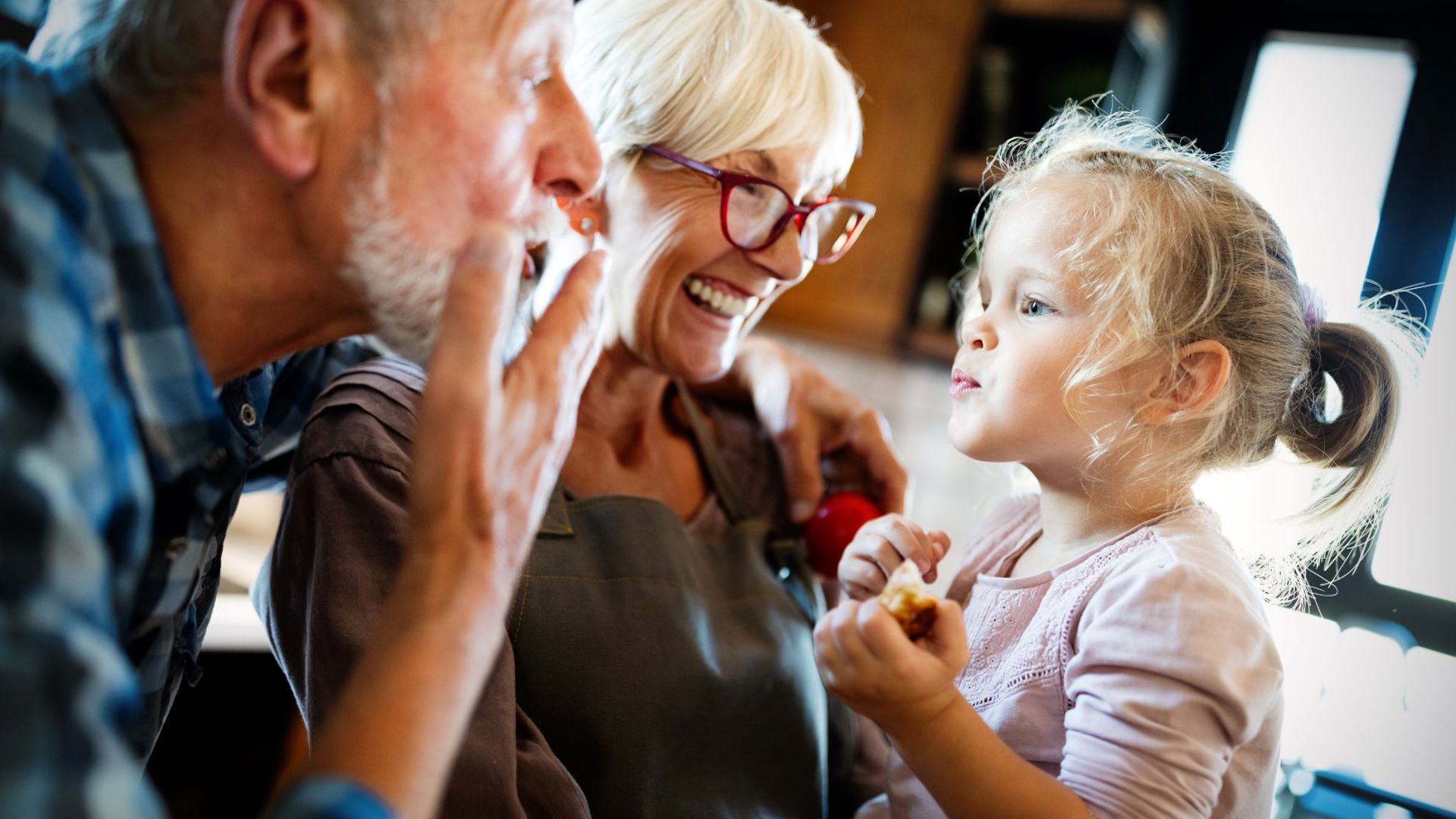 Couple playing with their grandchildren and following mental health support through their GMHBA extras