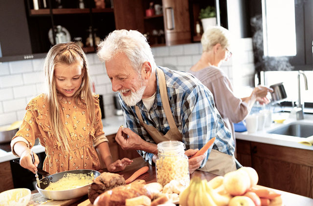 Family preparing a meal together in the kitchen