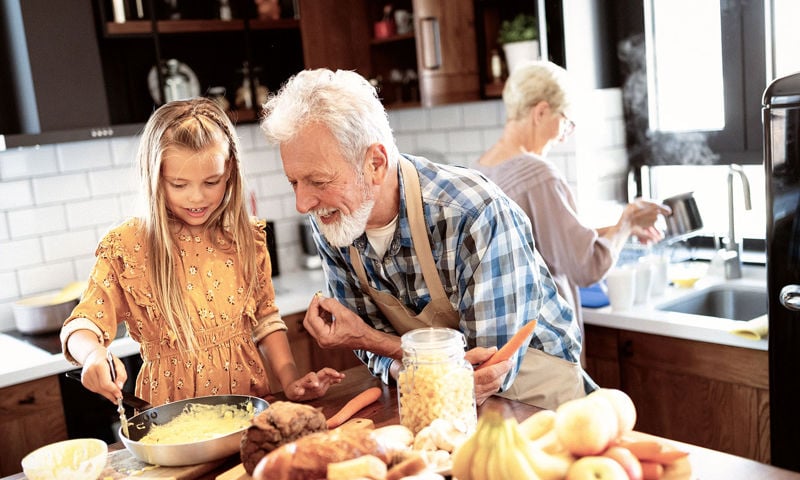 Family preparing a meal together in the kitchen