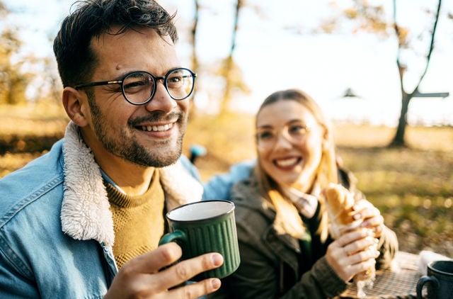 Couple enjoying a cup of tea in the countryside
