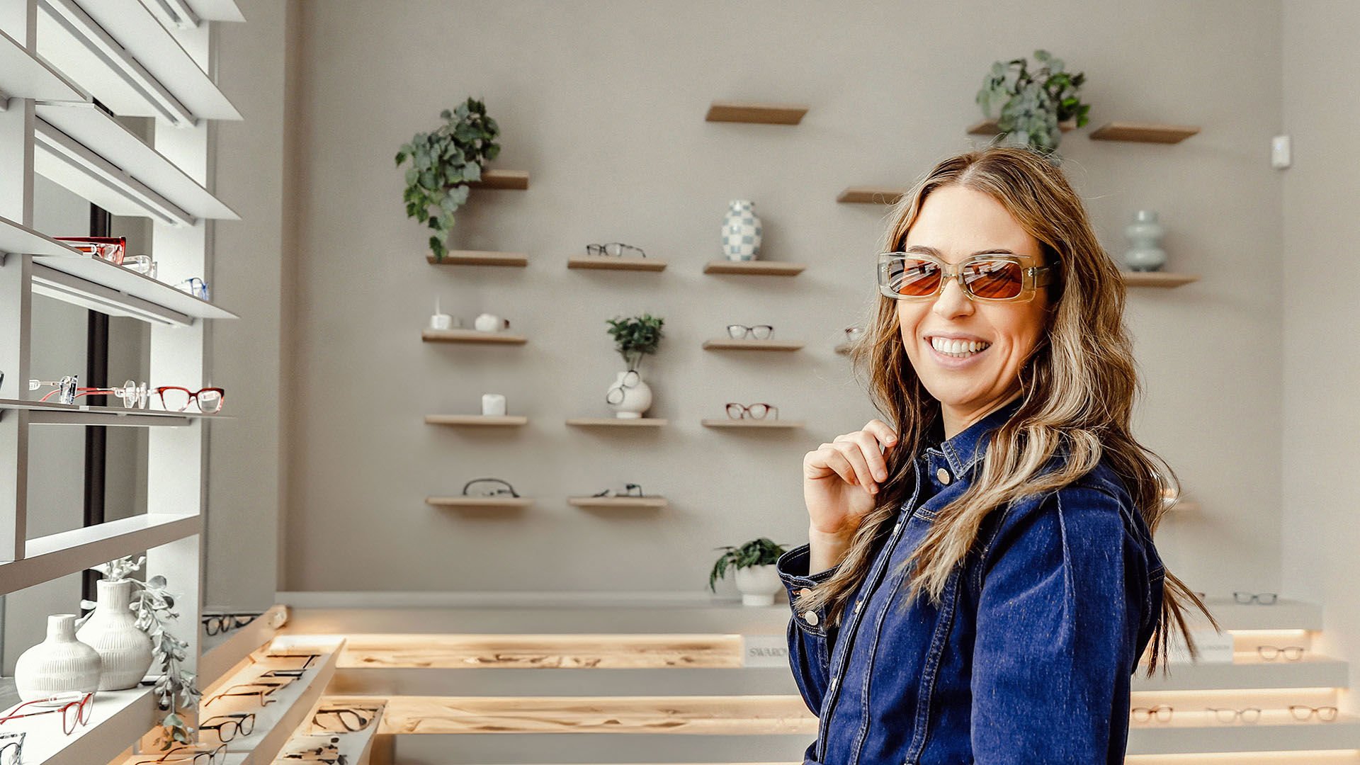 Women trying on glasses at GMHBA Eye Care