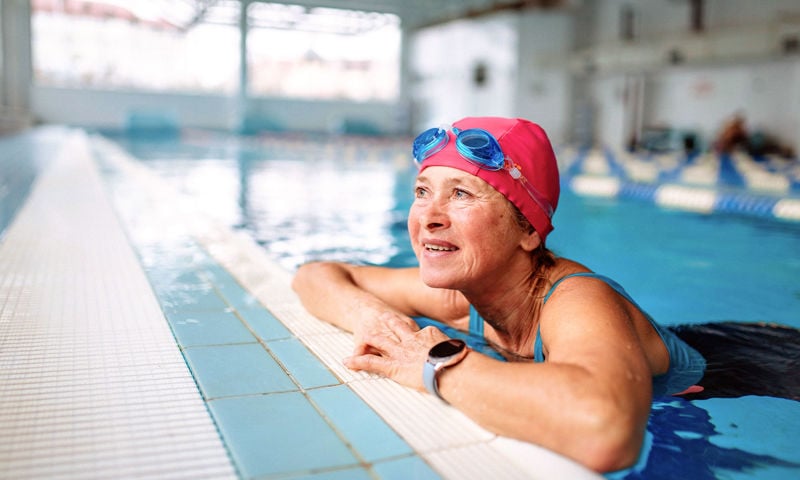 Lady enjoying laps in the swimming pool
