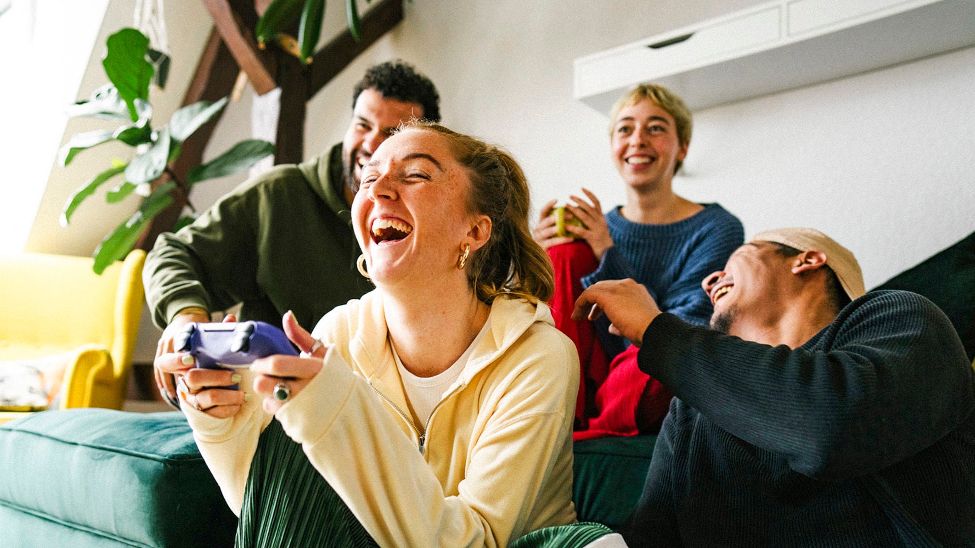 Group of people in their 20s enjoying a video game