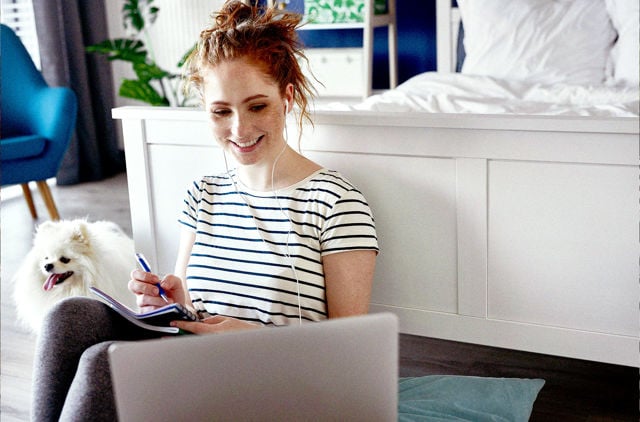 Neurodivergent young woman doing e-learning at home