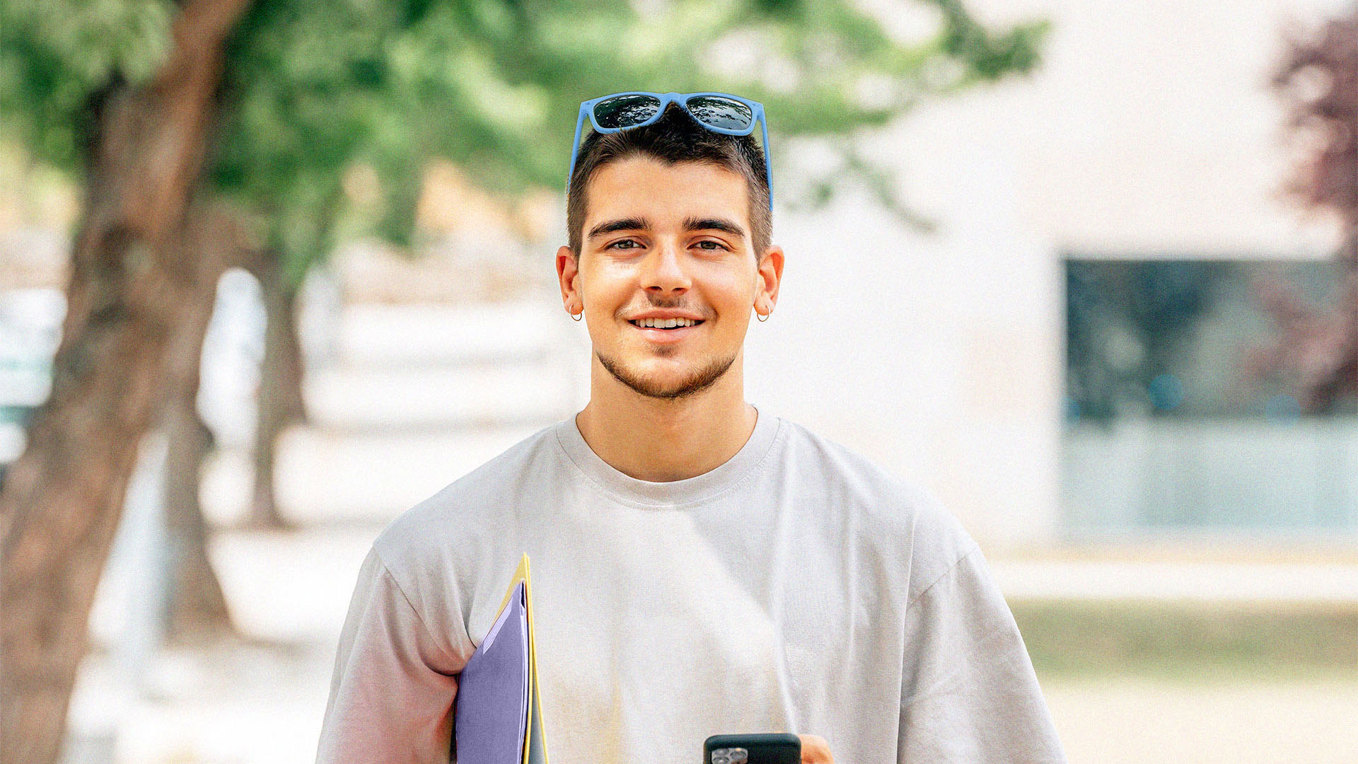 Under 30s male walking around uni campus