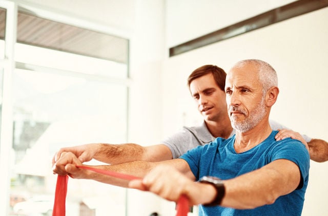 Man doing a stretch at rehab