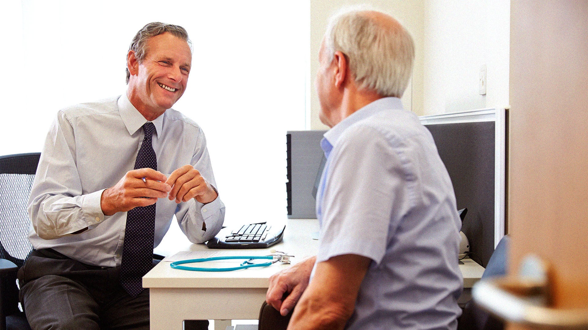 Doctor consulting with patient in office