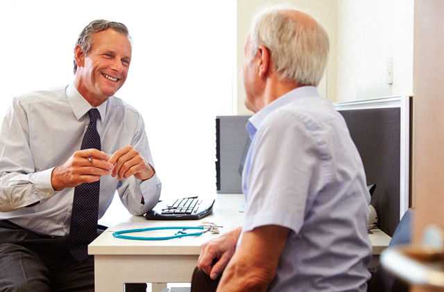 Doctor consulting with patient in office