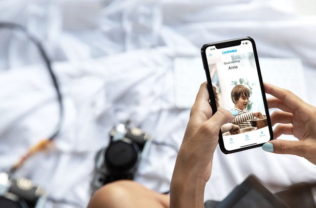 Person looking at GMHBA app on phone screen