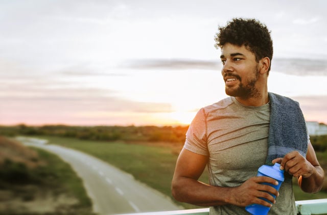 Man having a drink after run