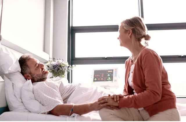Wife visiting husband in hospital