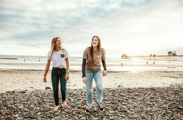 Young Females on beach new to health Insurance